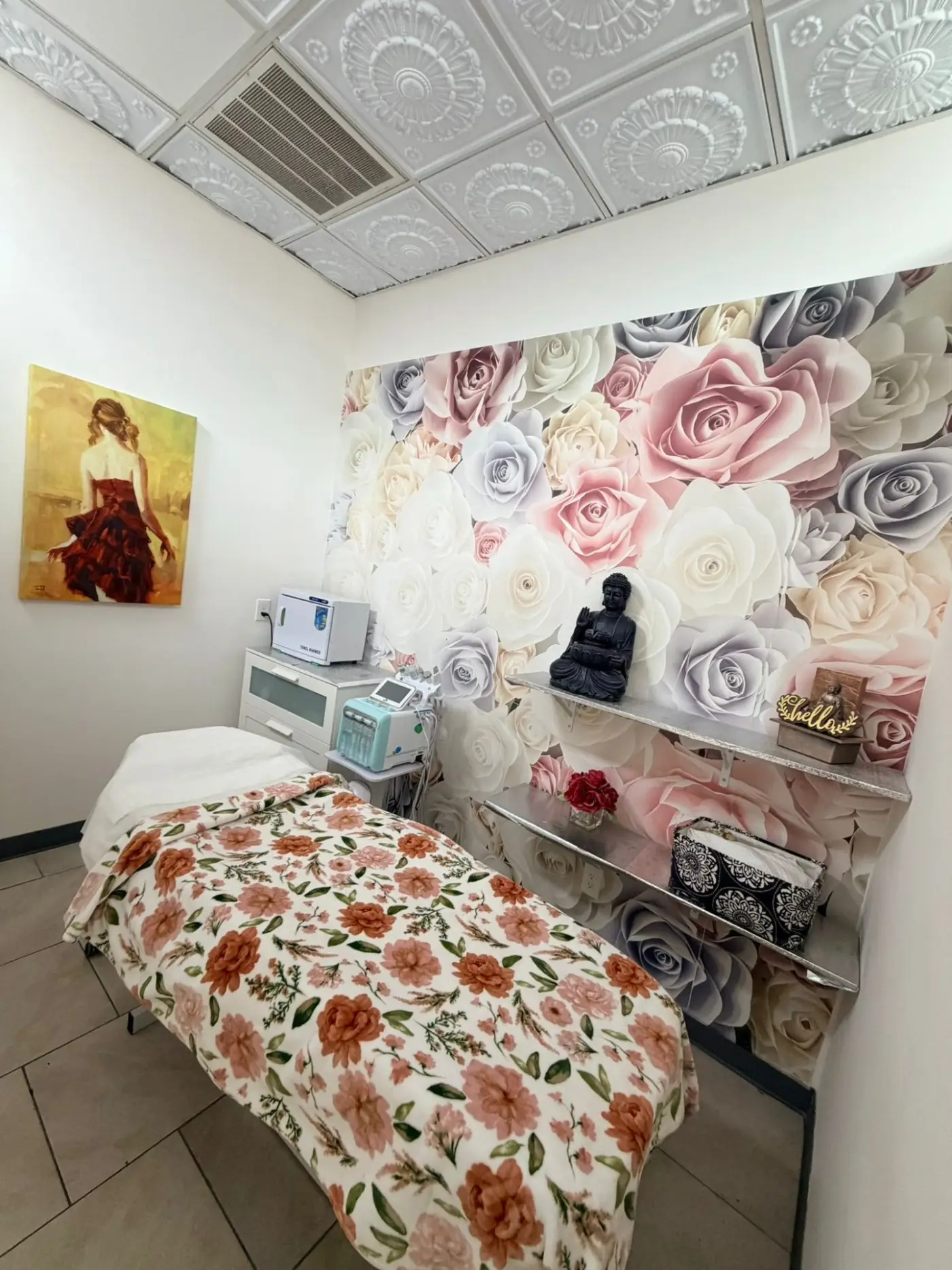 Magical Waxing private treatment room with floral wallpaper, professional waxing bed, and spa equipment — luxury waxing experience Atlanta